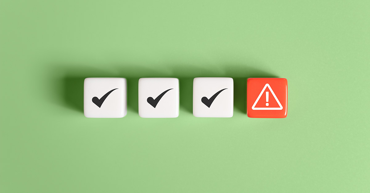 Three white blocks with checkmarks and one red warning block, illustrating compliance checks and potential risks in Medicare Cost Report reviews.